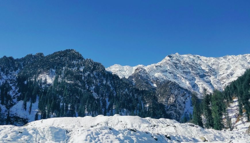 snow covered mountain under blue sky during daytime